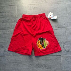 Vibrant Red Athletic Shorts with Blackhawks Logo